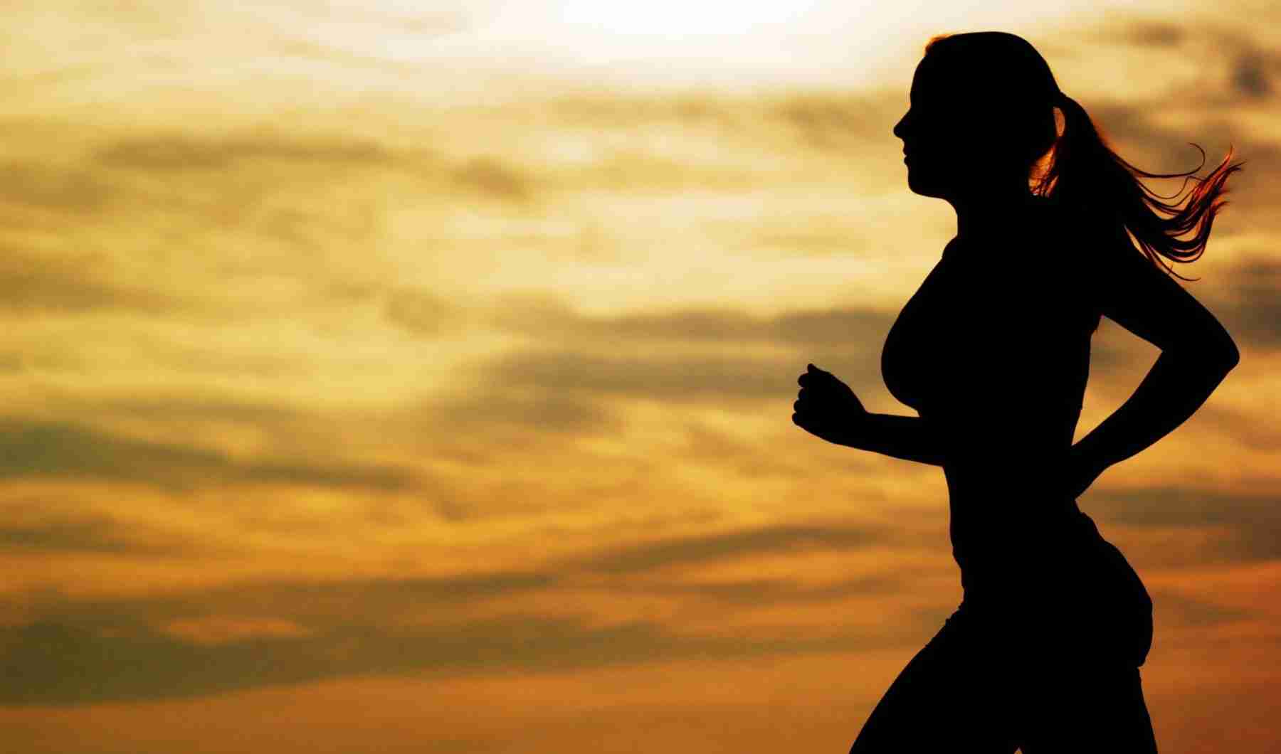girl shadow running in sunset